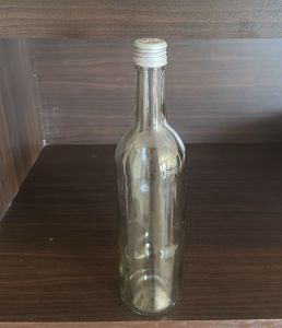 Clear Glass Bottle with Silver Cap