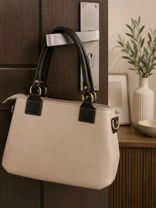 Elegant Beige Handbag with Black Handles