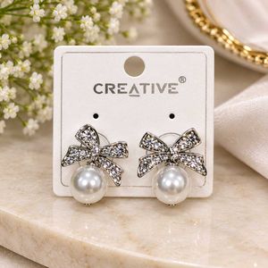 Elegant Pearl & Bow Earrings