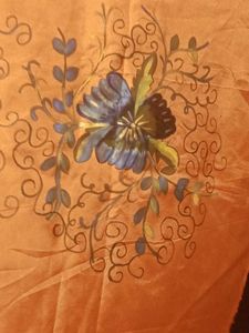 Orange colour dress material with Floral Border