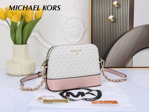 MICHAEL KORS* *MEDIUM LOGO DOME CROSSBODY SLING BA