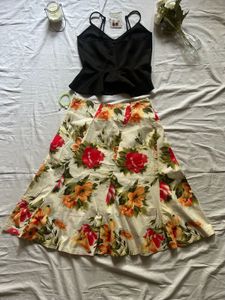 Chic Black Peplum Top &amp; Floral Skirt Set