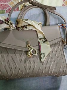 Chic Taupe Textured Handbag with Scarf Accent