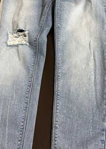 Ripped Light Wash Denim Jeans