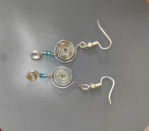 Silver Swirl Earrings with Blue Beads