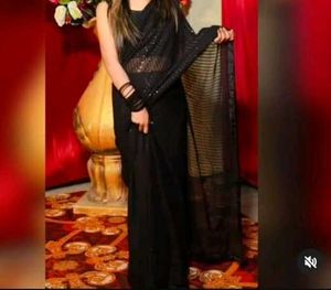 Black Saree With Padded Sleevless Blouse.