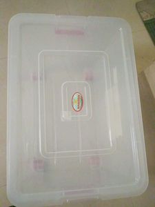 Clear Storage Bin with Assorted Contents