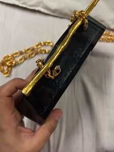 Designer Black Clutch with Gold Accents