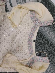 Elegant Cream Kurta Set with Intricate Embellishme