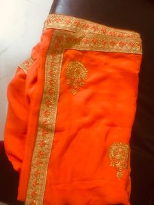 beautiful golden embroidery border orange saree