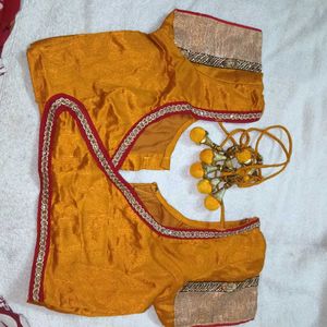 mustard yellow colour blouse with heavy latkan.