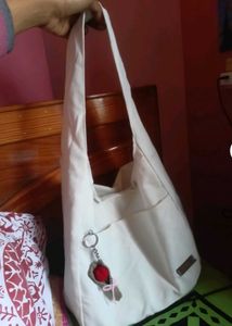Chic White Sling Bag with Flower Accent