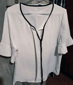 Chic White Blouse with Black Trim