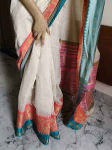 Elegant Cream Saree with Vibrant Border