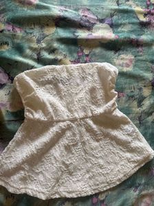 Two peplum  tops in black and white