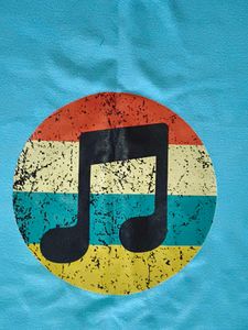 Light Blue Long Sleeve Top with Music Note Graphic