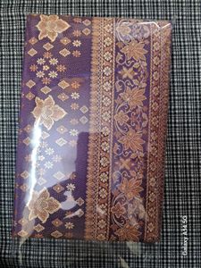 Elegant Purple Saree with Golden Floral