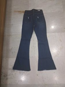 Ripped Flare Jeans - Stylish Denim