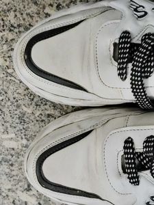 Stylish White Sneakers with Black Laces