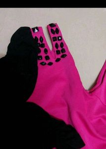 Vibrant Pink Dress with Black Embellished Sleeves