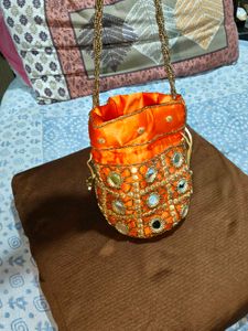 Embellished Orange Potli Bag new