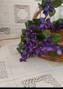 8. Wicker Basket with Purple Flowers
