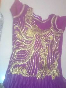 Elegant Purple Gown with Gold Embellishments