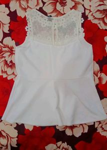 Chic White Peplum Top with Floral Neckline