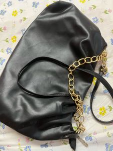 Chic Black Bag with Gold Chain Detail