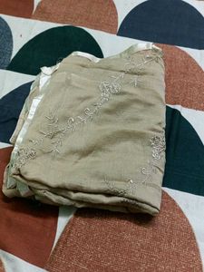 Elegant Beige Embroidered Saree