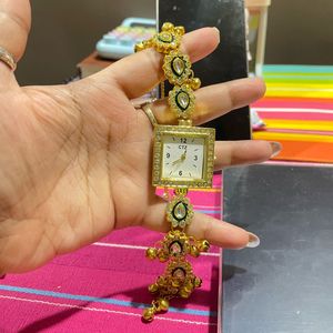 Elegant Gold Watch with Intricate Embellishments