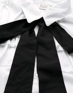 Chic White Ruffled Blouse with Black Bow 🤍