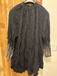 Chic Black Dress with Embellished Sleeves