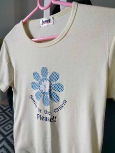 Cream T-Shirt with Blue Flower Graphic