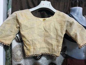 dark brown lehga with golden duppatta and blouse
