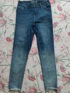Distressed Blue Denim Jeans
