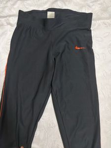 Nike Black Athletic Pants with Orange Stripe
