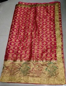 Reddish pink party wear organza tissue silk saree