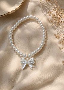 Chic Pearl Necklace with Bow Pendant