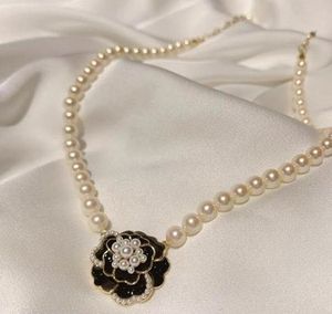 Elegant Pearl Necklace with Flower Pendant