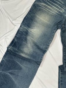 Distressed Blue Denim Jeans