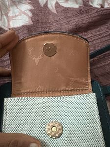 Allen Solly Green Crossbody Bag with Deer Emblem
