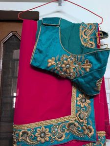 Elegant Red Saree with Green  Embroidery