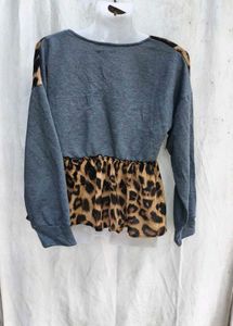 46209. Leopard Print Peplum Top