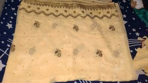 Elegant Cream Saree with Gold Embellishments