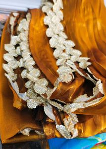 Orange Saree with Intricate Lace Border