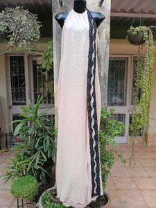 Halter neck sleek beige sequinned gown
