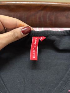 Stylish Black Top with Embroidered Neckline
