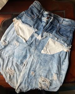 Y2K style distressed denim skirt