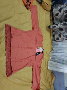 Elegant Coral Kurta with Lace Detailing
